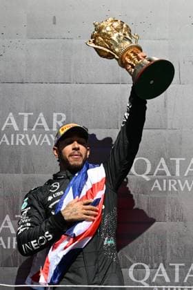 7th July 2024; Silverstone Circuit, Northamptonshire, England; Formula 1 2024 Qatar Airways British F1 Grand Prix; Race Day; Lewis Hamilton (44) of Mercedes holds the winners trophy aloft  ActionPlus12665882 SimonxWest