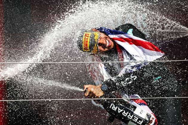 HAMILTON Lewis (gbr), Mercedes AMG F1 Team W15, portrait celebration podium with Ferrari champagne during the Formula 1 Qatar Airways British Grand Prix 2024, 12th round of the 2024 Formula One World Championship, WM, Weltmeisterschaft from July 5 to 7, 2024 on the Silverstone Circuit, in Silverstone, United Kingdom - F1 - BRITISH GRAND PRIX 2024 DPPI Panoramic  240707_R12_GRAN_BRETAGNA_DP_XB3_9654