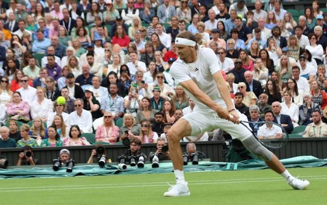 Germany s Alexander Zverev plays a backhand in his fourth round match against USA s Taylor Fritz at the 2024 Wimbledon Championships in London on Monday, July 08, 2024.  LON2024070838 HUGOxPHILPOTT