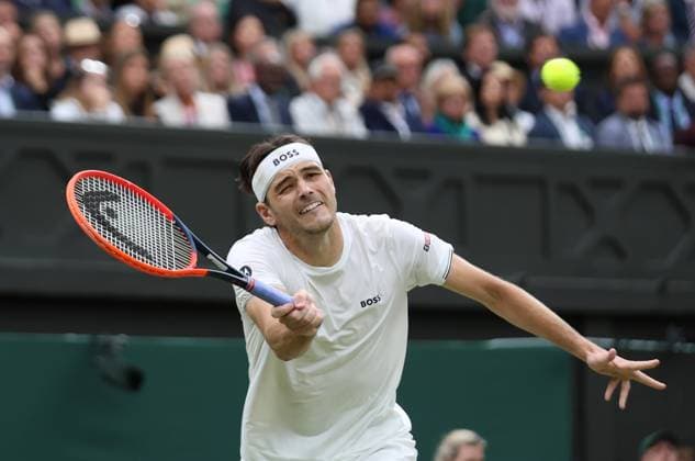 USA s Taylor Fritz plays a forehand in his fourth round match against Germany s Alexander Zverev at the 2024 Wimbledon Championships in London on Monday, July 08, 2024.  LON2024070887 HUGOxPHILPOTT