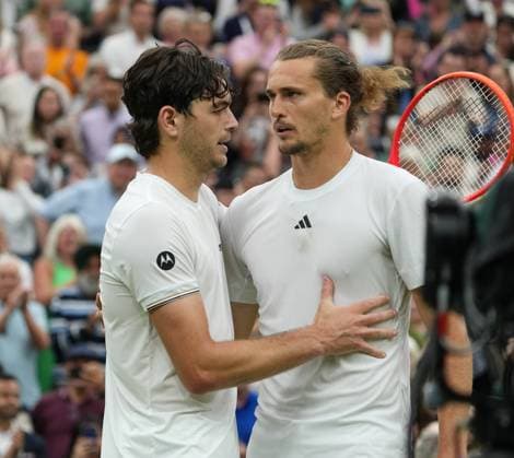 Lawn Tennis - 2024 Wimbledon Championship Mens Singles - Taylor Fritz (USA) v Alexander Zverev (GER) All England Lawn Tennis & Croquet Club - Monday 8th July 2024 Taylor Fritz (USA) consols Alexander Zverev at the net after the match 