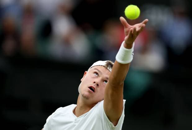 (240709) -- LONDON, July 9, 2024 -- Holger Rune serves during the men s singles 4th round match between Novak Djokovic of Serbia and Holger Rune of Denmark at Wimbledon tennis Championship in London, Britain, on July 8, 2024. ) (SP) BRITAIN-LONDON-TENNIS-WIMBLEDON-DAY 8 LixYing 