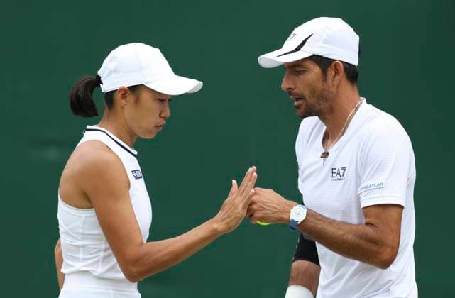 (240709) -- LONDON, July 9, 2024 -- Zhang Shuai (L) Marcelo Arevalo react during the mixed doubles first round match between Zhang Shuai (China) Marcelo Arevalo (El Salvador) and Rajeev Ram Katie Volynets of the United States at Wimbledon tennis Championship in London, Britain, July 8, 2024. ) (SP)BRITAIN-LONDON-TENNIS-WIMBLEDON-DAY 8 HanxYan 