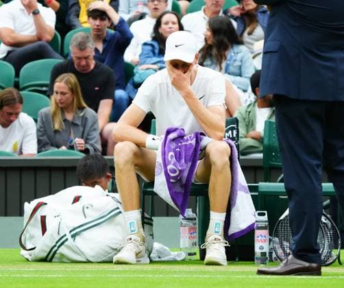 Jannik Sinner treated by a doctor and a physio after appearing to suffer with a dizzy spell during his quarter final match. He had his bloody pressure and oxygen levels checked before being helped off court Wimbledon Tennis Championships, Day 9, The All England Lawn Tennis and Croquet Club, London, UK - 09 Jul 2024  Copyright: xJavierxGarcia Shutterstockx 14577169ay