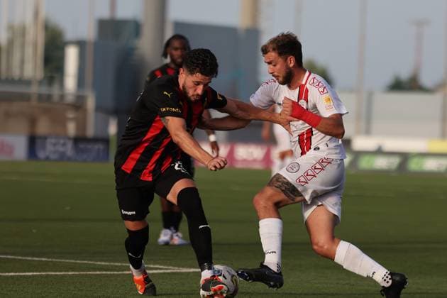 TA™ QALI, MALTA - JULY 09: Ethan Britto (R) of Lincoln Red Imps vies for the ball with Juan Corbalan (L) of Hamrun Spartans during the UEFA Champions League, First Qualifying Round, 1st Leg soccer match between Hamrun Spartans and Lincoln Red Imps, at the Centenary Stadium, in Ta Qali, Malta, 09 July 2024. Hamrrun Spartans v Lincoln Red Imps - UEFA Champions League 2024 2025, First Qualifying Round, 1st Leg