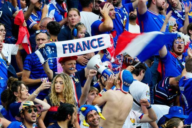 Supporters of France enjoy the pre-match atmosphere from the stands with flags and banners Spain v France, UEFA European Championship, EM, Europameisterschaft 2024, Semi Final, Football, Munich Football Arena, Munich, Germany - 09 Jul 2024 EDITORIAL USE ONLY No use with unauthorised audio, video, data, fixture lists, club league logos or live services. Online in-match use limited to 120 images, no video emulation. No use in betting, games or single club league player publications.  Copyright: xDavexShopland Shutterstockx 14576888l