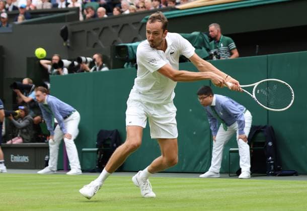 Daniil Medvedev plays a backhand in his Men s Quarter-Final match against Italy s Jannik Sinner at the 2024 Wimbledon Championships in London on Tuesday, July 09, 2024.  LON2024070949 HUGOxPHILPOTT