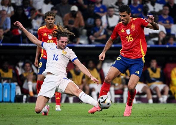 Russia Soccer Euro 2024 Spain - France 8726055 09.07.2024 France s Adrien Rabiot and Spain s Rodri struggle for the ball during the UEFA EURO, EM, Europameisterschaft,Fussball 2024 semi-final soccer match between Spain and France at the Munich Football Arena in Munich, Germany. Alexey Filippov Sputnik Munich Germany  Copyright: xAlexeyxFilippovx