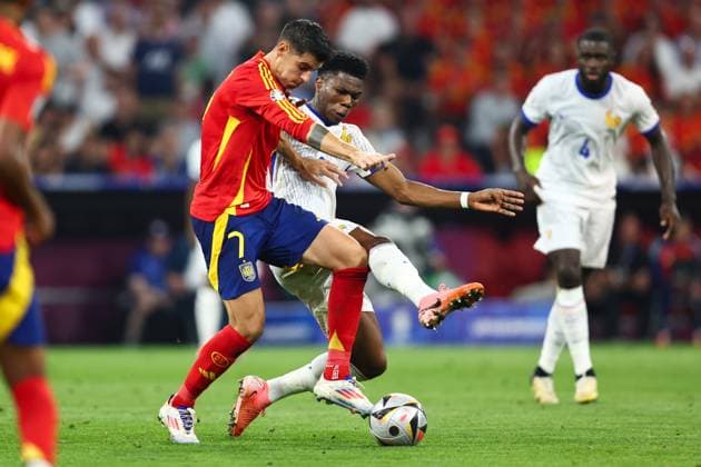 Spain v France 9 July 2024, Munich - UEFA EUROs - Semi-Final - Spain v France - Aurelien Tchouameni of France tackles Alvaro Morata of Spain - Photo: Charlotte Wilson Offside. Munich Germany Copyright: xCharlottexWilsonx xOffsidexOffside