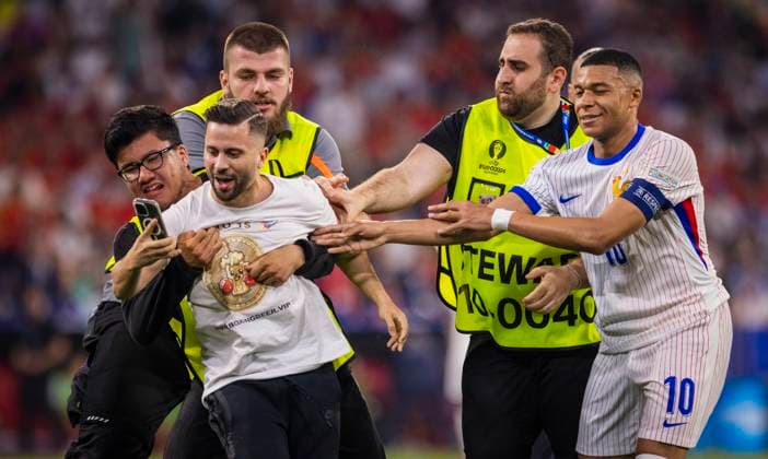 Munich, Germany. 09th Jul 2024. Speedster takes a selfie with Kylian Mbappe (FRA) and is stopped by stewards Spain - France Spanien - Frankreich 09.07.2024