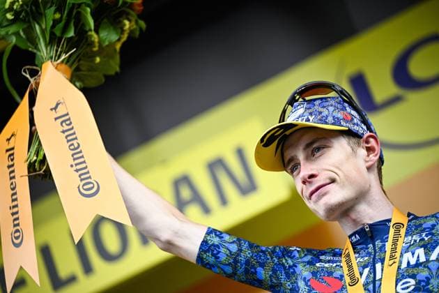 Danish Jonas Vingegaard of Team Visma-Lease a Bike celebrates on the podium after winning stage 11 of the 2024 Tour de France cycling race, from Evaux-les-Bains to Le Lioran, France (211km) on Wednesday 10 July 2024. The 111th edition of the Tour de France starts on Saturday 29 June and will finish in Nice, France on 21 July. JASPERxJACOBS  x96197028x