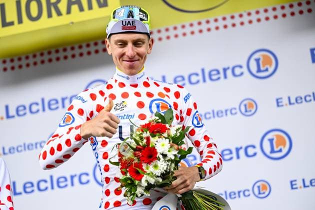 Slovenian Tadej Pogacar of UAE Team Emirates celebrates on the podium in the red polka-dot jersey for best climber after stage 11 of the 2024 Tour de France cycling race, from Evaux-les-Bains to Le Lioran, France (211km) on Wednesday 10 July 2024. The 111th edition of the Tour de France starts on Saturday 29 June and will finish in Nice, France on 21 July. JASPERxJACOBS  x96197276x