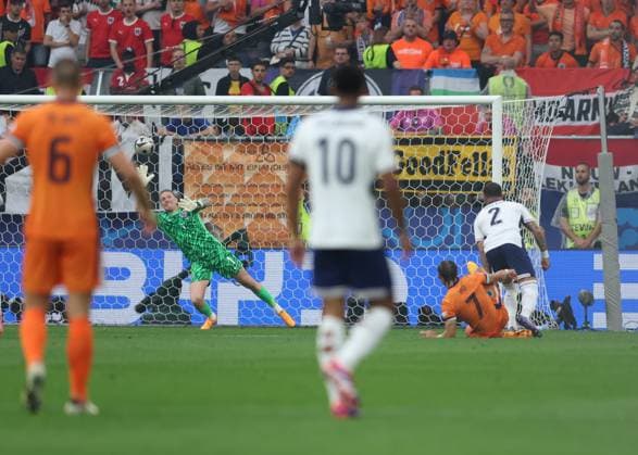 Dortmund, Germany, 10th July 2024. Jordan Pickford of England fails to keep out a shot from Xavi Simons of Netherlands during the UEFA European Championships semi final match at BVB Stadion, Dortmund. Picture credit should read: Paul Terry Sportimage EDITORIAL USE ONLY. No use with unauthorised audio, video, data, fixture lists, club league logos or live services. Online in-match use limited to 120 images, no video emulation. No use in betting, games or single club league player publications. SPI-3222-0020