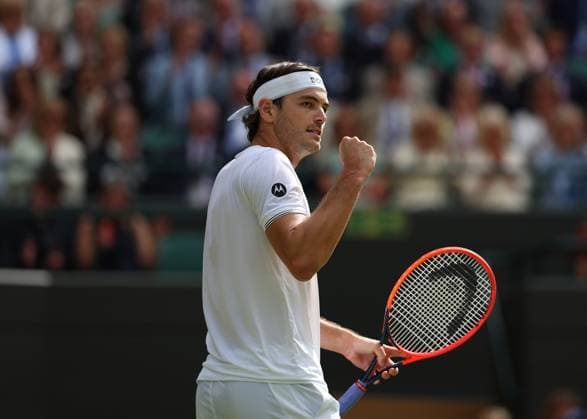 10th July 2024; All England Lawn Tennis and Croquet Club, London, England; Wimbledon Tennis Tournament, Day 10; Taylor Fritz (USA) wearing both Motorola and Hugo Boss white outfit celebrates taking another game against Lorenzo Musetti (ITA), mens singles quarter final match  ActionPlus12666676 JohnxPatrickxFletcher
