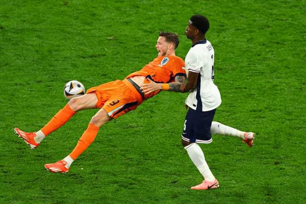 Wout Weghorst of The Netherlands is challenged by Marc GuÃ hi of England Netherlands v England, UEFA European Championship, EM, Europameisterschaft 2024, Semi Final, Football, BVB Stadion, Dortmund, Germany, 10 Jul 2024 EDITORIAL USE ONLY No use with unauthorised audio, video, data, fixture lists, club league logos or live services. Online in-match use limited to 120 images, no video emulation. No use in betting, games or single club league player publications.  Copyright: xKieranxMcManus Shutterstockx 14576895cd