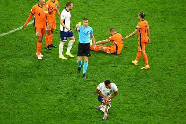 Jude Bellingham of England receives a yellow card from Referee Felix Zwayer after fouling Stefan de Vrij of The Netherlands Netherlands v England, UEFA European Championship, EM, Europameisterschaft 2024, Semi Final, Football, BVB Stadion, Dortmund, Germany, 10 Jul 2024 EDITORIAL USE ONLY No use with unauthorised audio, video, data, fixture lists, club league logos or live services. Online in-match use limited to 120 images, no video emulation. No use in betting, games or single club league player publications.  Copyright: xKieranxMcManus Shutterstockx 14576895ci