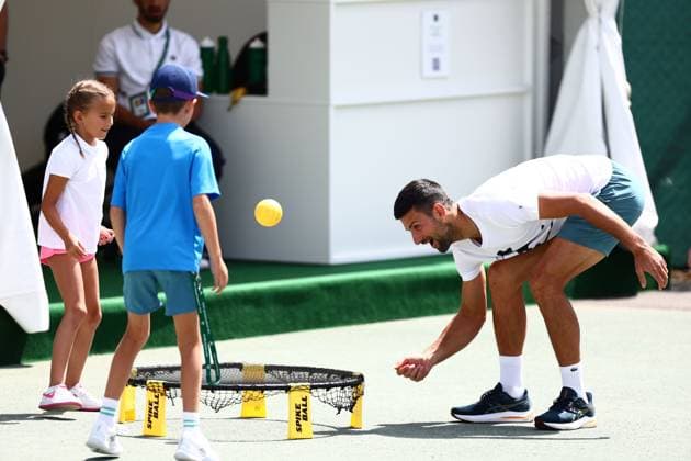 Novak Djokovic exercising with his children Wimbledon Tennis Championships, Day 11, The All England Lawn Tennis and Croquet Club, London, UK - 11 Jul 2024  Copyright: xJamesxMarsh Shutterstockx 14580282ag