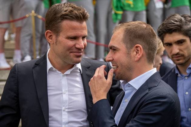 Munich, Bavaria, Germany - 11 July 2024: Honoring the volunteers of the European Championships in the Lower Hofgarten in Munich. Soccer referee Felix Brych and tournament director Philipp Lahm talk