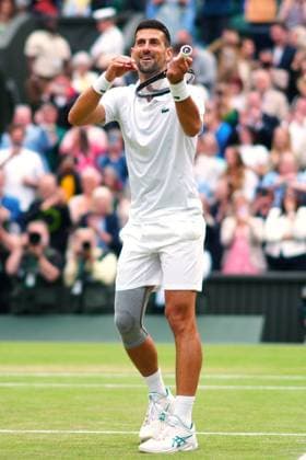 Novak Djokovic celebrates by playing the violin after winning his semi final match Wimbledon Tennis Championships, Day 12, The All England Lawn Tennis and Croquet Club, London, UK - 12 Jul 2024  Copyright: xJavierxGarcia Shutterstockx 14581882if