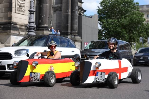 Berlin, Germany. 13th July 2024. England and Spain fans in small cars with national flags on prior to the final taking place in Berlin, Germany. Picture date: 13th July 2024. Picture Paul Terry Sportimage EDITORIAL USE ONLY. No use with unauthorised audio, video, data, fixture lists, club league logos or live services. Online in-match use limited to 120 images, no video emulation. No use in betting, games or single club league player publications. SPI-3231-0012
