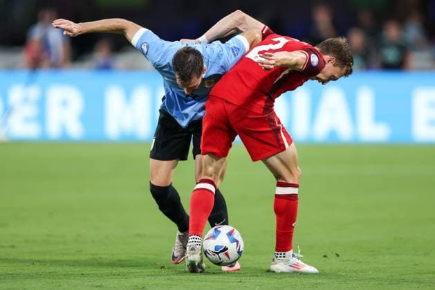 July 13, 2024, Charlotte, North Carolina, U.S: Canada defender ALISTAIR JOHNSTON (2) competes for the ball against Uruguay defender MATIAS VINA (17) during the first half of the CONMEBOL Copa America match between Uruguay and Canada at Bank of America Stadium in Charlotte, NC on July 13, 2024. Charlotte U.S - ZUMAk149 20240713_zsp_k149_029 Copyright: xCoryxKnowltonx