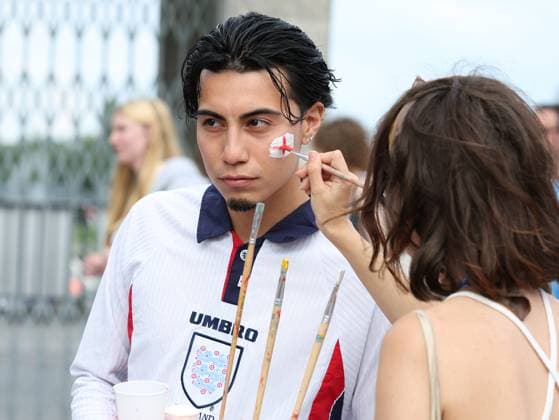 Berlin, Germany, 14th July 2024. An England fan has his face painted as he arrives prior to the UEFA European Championships final match at Olympiastadion, Berlin. Picture: Paul Terry Sportimage EDITORIAL USE ONLY. No use with unauthorised audio, video, data, fixture lists, club league logos or live services. Online in-match use limited to 120 images, no video emulation. No use in betting, games or single club league player publications. SPI-3227-0013