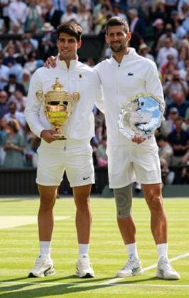 Tennis - Wimbledon Championship 2024 - Day 14 LONDON, ENGLAND - Sunday, July 14, 2024: Champions Carlos Alcaraz (ESP) (L) with runner-up Novak Djokovic (SRB) after the Gentlemen s Singles Final on Day Fourteen of The Championships Wimbledon 2024 at the All England Lawn Tennis and Croquet Club. Alcaraz won 6-2, 6-2, 7-6 (4). (Photo by Kirsten Holst Propaganda) LONDON All England Lawn Tennis and Croquet Club GREATER LONDON ENGLAND  Copyright: xKirstenxHolstx 2024-07-14-005-Wimbledon_Day_14