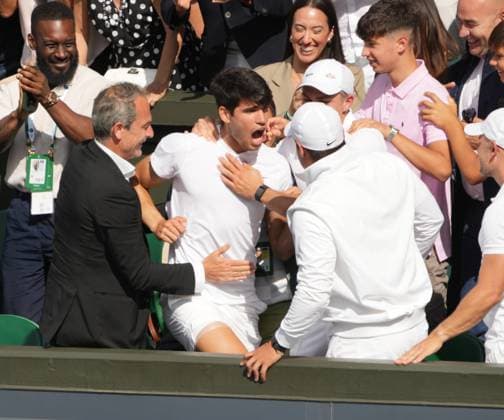 Lawn Tennis - 2024 Wimbledon Championship Mens singles final Novak Djokovic (SRB) v Carlos Alcaraz (ESP) All England Lawn Tennis & Croquet Club - Sunday 14th July 2024 Carlos Alcaraz climbs into the players box to hug his coaching staff and Family 