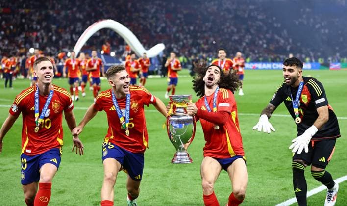 Dani Olmo, Marc Cucurella, Fermin Lopez and David Raya of Spain celebrate winning the 2024 UEFA European Football Championship with the Trophy Spain v England, UEFA European Championship, EM, Europameisterschaft 2024, Final, Football, Olympiastadion, Berlin, Germany, 14 Jul 2024 EDITORIAL USE ONLY No use with unauthorised audio, video, data, fixture lists, club league logos or live services. Online in-match use limited to 120 images, no video emulation. No use in betting, games or single club league player publications. Copyright: xMichaelxZemanek Shutterstockx 14583343fg