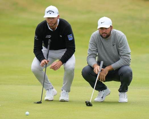 17th July 2024; Royal Troon Golf Club, Troon, South Ayrshire, Scotland; The Open Championship Practice Day 3; Scottie Scheffler and Sam Burns study their putts on the 15th green  ActionPlus12669042 StevenxFlynn
