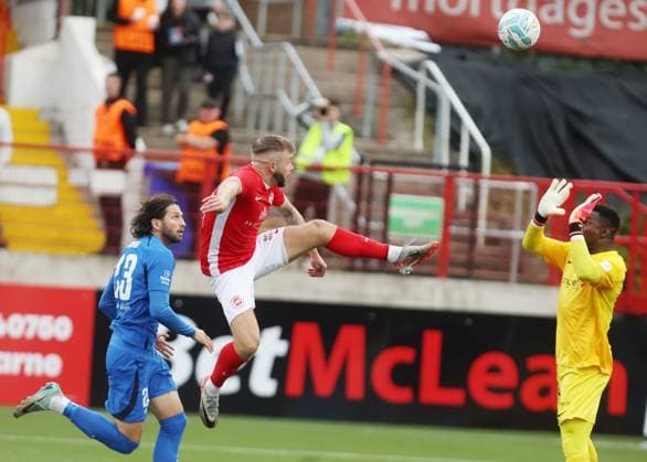 UEFA Champions League First Qualifying Round Second Leg, Inver Park, Larne 17 7 2024 Larne vs RFS Larne™s Andrew Ryan with RFS™ Herdi Prenga and goalkeeper Fabrice Ondoa Andrew Ryan with Herdi Prenga and goalkeeper Fabrice Ondoa 17 7 2024  Copyright: x INPHO JonathanxPorterx pe_00959209