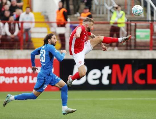 UEFA Champions League First Qualifying Round Second Leg, Inver Park, Larne 17 7 2024 Larne vs RFS Larne™s Andrew Ryan with RFS™ Herdi Prenga Andrew Ryan with Herdi Prenga 17 7 2024  Copyright: x INPHO JonathanxPorterx pe_00959212