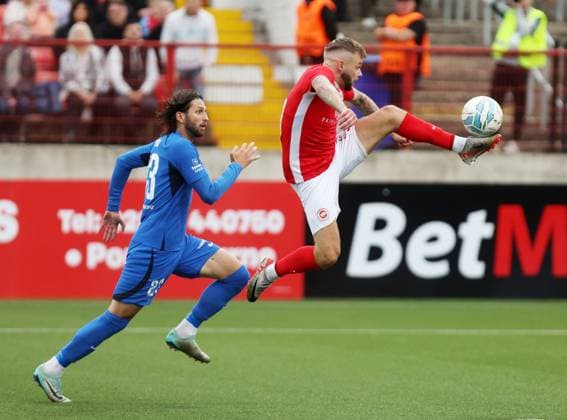 UEFA Champions League First Qualifying Round Second Leg, Inver Park, Larne 17 7 2024 Larne vs RFS Larne™s Andrew Ryan with RFS™ Herdi Prenga Andrew Ryan with Herdi Prenga 17 7 2024  Copyright: x INPHO JonathanxPorterx pe_00959214
