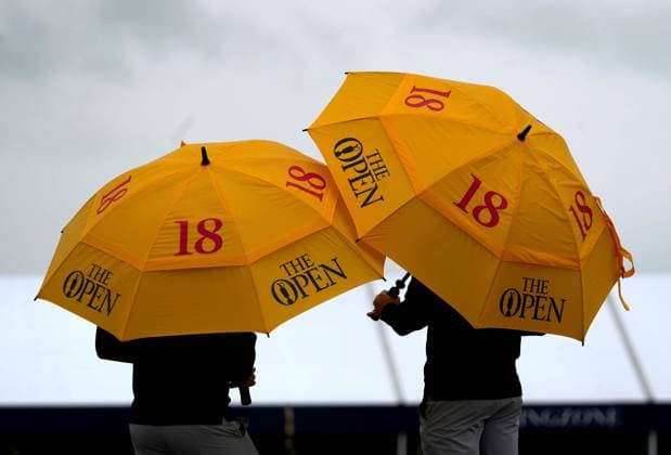 Golf fans with The Open branded umbrellas. The British Open Championship, Day One, Golf, Royal Troon, Troon, UK - 18 July 2024  Copyright: xStuartxWallace Shutterstockx 14588001r