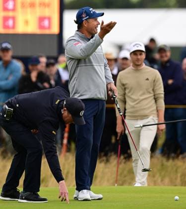 After his ball was moved by another ball on the 4th Green, Padraig Harrington barters with the crowd and marshals as to how close to the hole it was in a The Prices Right Moment The British Open Championship, Day Two, Golf, Royal Troon, Troon, UK - 19 July 2024  Copyright: xGreigxCowie Shutterstockx 14587995aq