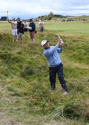 American Denny McCarthy hits out of the rough during the second round at the 152nd Open Championship at Royal Troon Golf Club in Troon, Scotland on Friday, July 19, 2024. Tiger Woods missed the cut and finished with a score of fourteen over par.  LON2024071908 HUGOxPHILPOTT