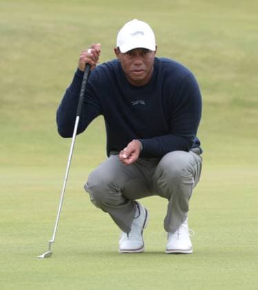 American Tiger Woods lines up a putt during the second round at the 152nd Open Championship at Royal Troon Golf Club in Troon, Scotland on Friday, July 19, 2024. Tiger Woods missed the cut and finished with a score of fourteen over par.  LON2024071968 HUGOxPHILPOTT