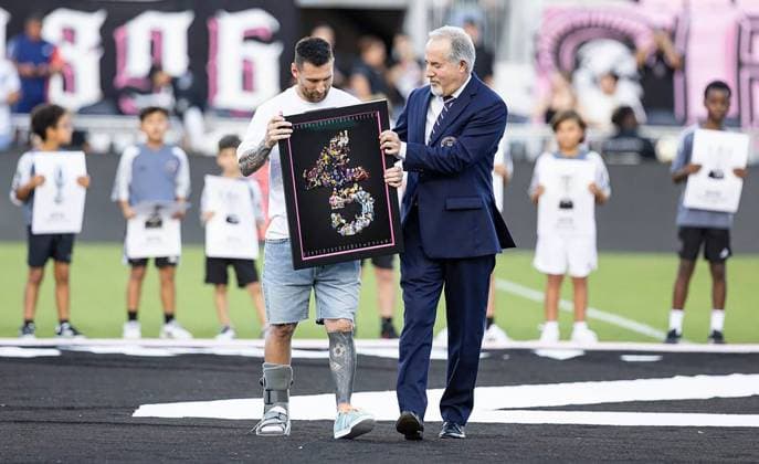 July 22, 2024: Inter Miami forward Lionel Messi, wearing a walking boot on his injured right foot, is recognized for winning 45 titles throughout his career by Inter Miami co-owner Jorge Mas during a ceremony before their team s MLS, Fussball Herren, USA match against Chicago Fire at Chase Stadium on Saturday, July 20, 2024, in Fort Lauderdale, Florida. - ZUMAm67_ 0714919587st Copyright: xMatiasxJ.xOcnerx