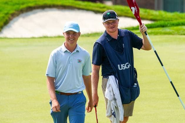 July 23, 2024, Bloomfield Hills, Michigan, USA: Mike McConie (L) of Huntington, New York and his caddie walk off the 9th green during the second round of the 2024 U.S. Junior Amateur Championship at Oakland Hills Country Club. Bloomfield Hills USA - ZUMAw109 20240723_fap_w109_021 Copyright: xDebbyxWongx