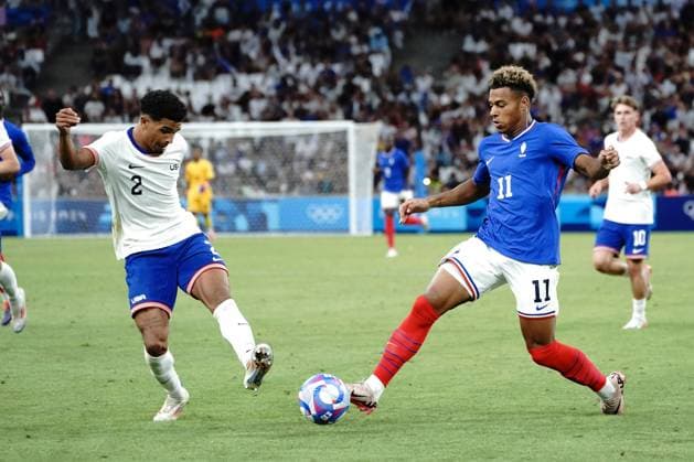 Désiré Doué (France) and Nathan Harriel (USA), Football , France vs USA during the Olympic Games, Olympische Spiele, Olympia, OS Paris 2024 JO 2024 : FOOTBALL - France vs Etats Unis - Jeux Olympiques 2024 - Paris2024 - Marseille - 24 07 2024 DPPI Panoramic 