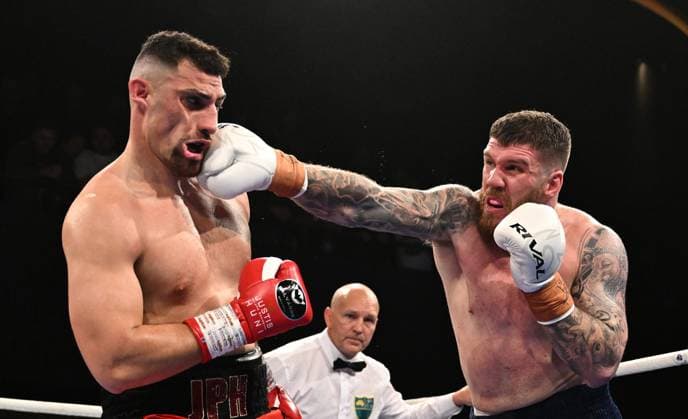 Sport Themen der Woche KW30 Sport Bilder des Tages BOXING HUNI PILCHER, Justis Huni (left) is punched by Troy Pilcher (right) during the WBO global heavyweight title fight between Justis Huni and Troy Pilcher at the Fortitude Valley Music Hall in Brisbane, Thursday, July 25, 2024. ( NO ARCHIVING, EDITORIAL USE ONLY, NO USE IN BOOKS WITHOUT CONSENT BRISBANE QUEENSLAND AUSTRALIA  Copyright: xDARRENxENGLANDx 20240725157910880718