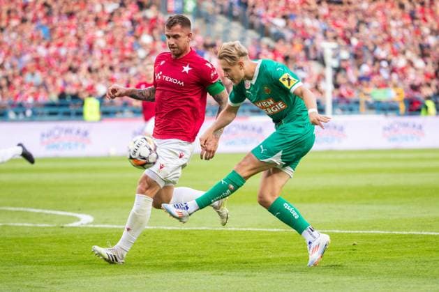 SOCCER - UEFA EL, Krakow vs Rapid KRAKOW,POLAND,25.JUL.24 - SOCCER - UEFA Europa League, qualification, Wisla Krakow vs SK Rapid Wien. Image shows Alan Uryga (Krakow) and Noah Bischof (Rapid).  GEPAxpictures xPhilippxBrem