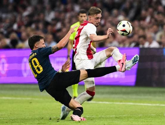 AMSTERDAM - (l-r) Njegos Petrovic of FK Vojvodina, Kenneth Taylor of Ajax during the UEFA Europa League 2nd preliminary round match between Ajax Amsterdam and FK Vojvodina at the Johan Cruijff ArenA on July 25, 2024 in Amsterdam, Netherlands. ANP OLAF KRAAK UEFA Europa Europa League second qualifying round 2024 25 xVIxANPxSportx xxANPxIVx 504188327 originalFilename: 504188327.jpg
