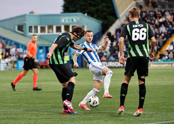 Kilmarnock v Cercle Brugge UEFA Europa League Edgaras Utkus of Cercle Brugge (left) clears under pressure from Bruce Anderson of Kilmarnock (middle) during the UEFA Europa League Second Qualifying Round First Leg match at Rugby Park, Kilmarnock UK Newspapers OUT Copyright: xFredxPalmerx FIL-20396-0101