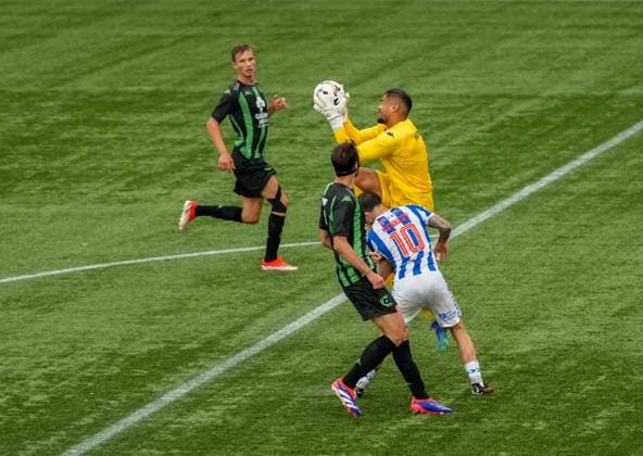 Cercle Brugge goalkeeper Warleson appears to make contact with Matty Kennedy of Kilmarnock inside the Brugge penalty area before he catches the ball. Referee Martin Dohal never gave a penalty kick. Kilmarnock v Cercle Brugge, UEFA Europa League, 2nd Qualifying Round, Football, The BBSP Stadium Rugby Park, Kilmarnock, UK, 25 Jul 2024 EDITORIAL USE ONLY No use with unauthorised audio, video, data, fixture lists, club league logos or live services. Online in-match use limited to 120 images, no video emulation. No use in betting, games or single club league player publications.  Copyright: xStuartxWallace Shutterstockx 14602352cg