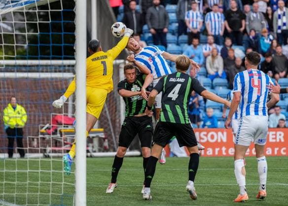 Cercle Brugge goalkeeper Warleson punches the ball away from the head of Brad Lyons of Kilmarnock. Kilmarnock v Cercle Brugge, UEFA Europa League, 2nd Qualifying Round, Football, The BBSP Stadium Rugby Park, Kilmarnock, UK, 25 Jul 2024 EDITORIAL USE ONLY No use with unauthorised audio, video, data, fixture lists, club league logos or live services. Online in-match use limited to 120 images, no video emulation. No use in betting, games or single club league player publications.  Copyright: xStuartxWallace Shutterstockx 14602352cp