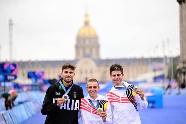 Italian silver medallist Filippo Ganna, Belgian gold medallist Remco Evenepoel and Belgian bronze medallist Wout van Aert pictured during the podium ceremony of the men s time trial event at the Paris 2024 Olympic Games, Olympische Spiele, Olympia, OS on Saturday 27 July 2024 in Paris, France . The Games of the XXXIII Olympiad are taking place in Paris from 26 July to 11 August. The Belgian delegation counts 165 athletes in 21 sports. LAURIExDIEFFEMBACQ  x97170986x