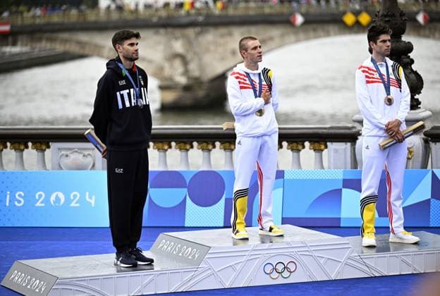 Italian silver medallist Filippo Ganna, Belgian gold medallist Remco Evenepoel and Belgian bronze medallist Wout van Aert pictured during the podium ceremony of the men s time trial event at the Paris 2024 Olympic Games, Olympische Spiele, Olympia, OS on Saturday 27 July 2024 in Paris, France . The Games of the XXXIII Olympiad are taking place in Paris from 26 July to 11 August. The Belgian delegation counts 165 athletes in 21 sports. JASPERxJACOBS  x97172210x