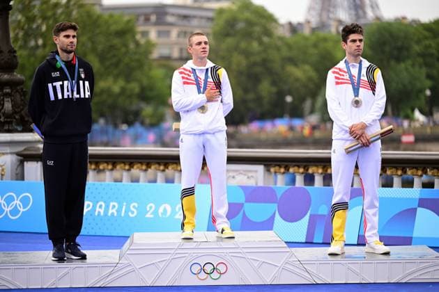 Italian silver medallist Filippo Ganna, Belgian gold medallist Remco Evenepoel and Belgian bronze medallist Wout van Aert pictured during the podium ceremony of the men s time trial event at the Paris 2024 Olympic Games, Olympische Spiele, Olympia, OS on Saturday 27 July 2024 in Paris, France . The Games of the XXXIII Olympiad are taking place in Paris from 26 July to 11 August. The Belgian delegation counts 165 athletes in 21 sports. LAURIExDIEFFEMBACQ  x97173063x