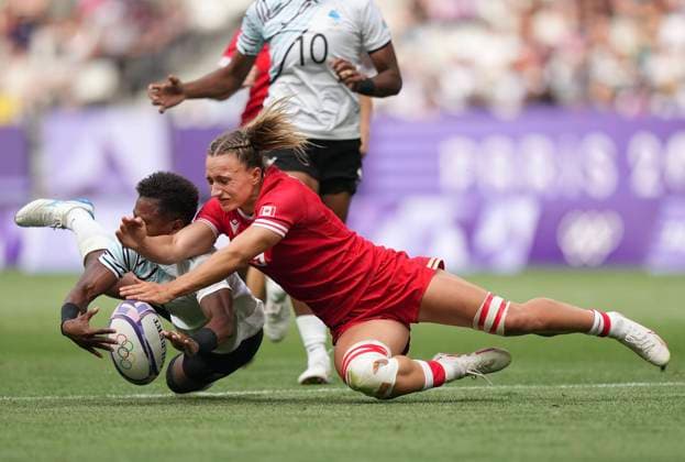July 28, 2024, Paris, FRANCE: Canada forward Krissy Scurfield (9) battles for the loose ball against Fiji forward Laisana Likuceva (10) during second half Women rugby 7s rugby action at the Paris Summer Olympics in Paris, France on Sunday, July 28, 2024. Canada News - July 28, 2024  - ZUMAc35_ 20240728_zaf_c35_051 Copyright: xNathanxDenettex